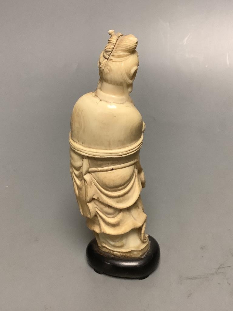 A Chinese ivory figure and a bowenite jade carving